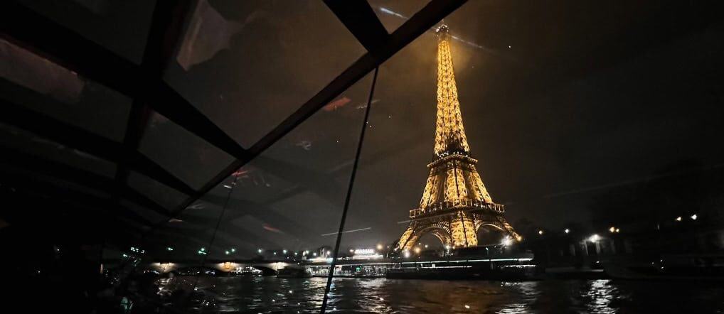 Is Paris Worth Visiting? My Honest Opinion 7 this is an image of the Eiffel tower lit up at night