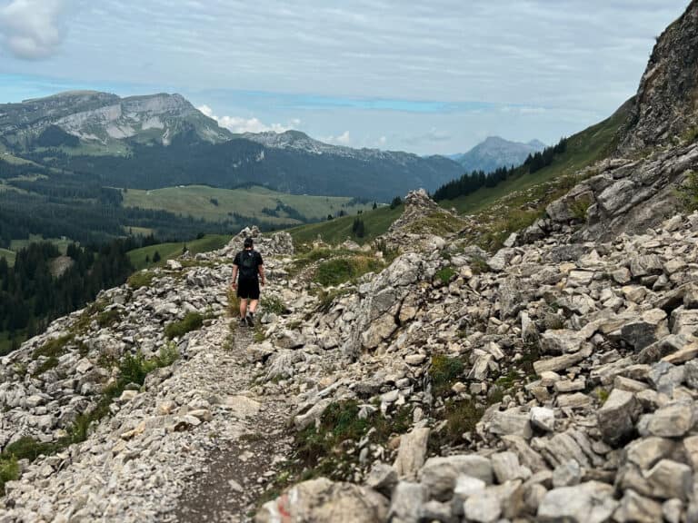 Guide to Hiking in Interlaken: 8 Incredible Trails for Every Fitness Level 23 Man hiking in Interlaken along a rocky trail